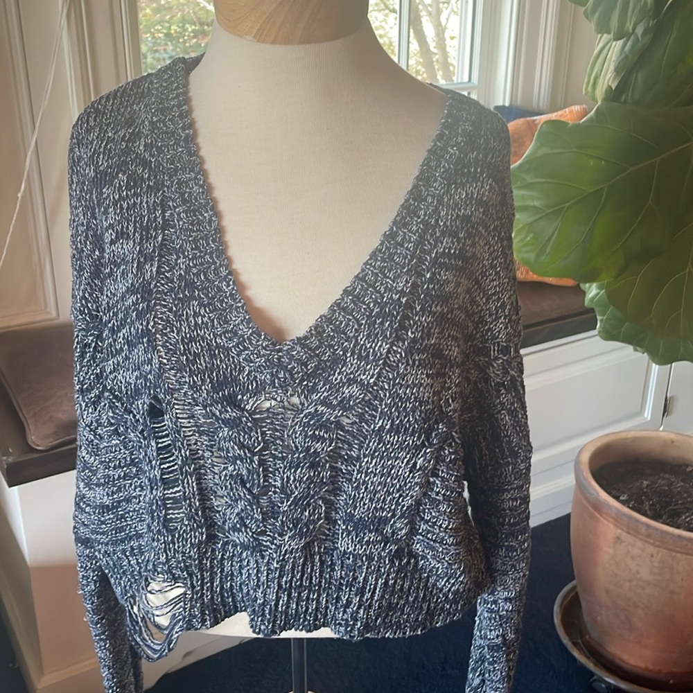 Wildfox sweater.  Distressed by design.